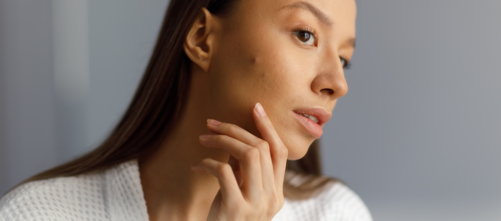women looking at her skin