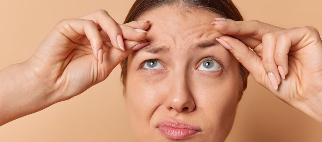 woman displeased with wrinkles