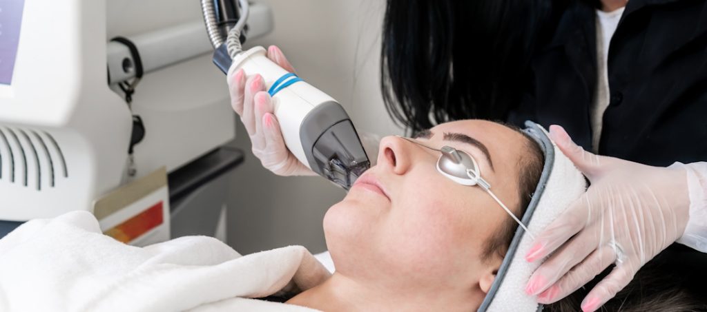 woman receiving laser skin treatment