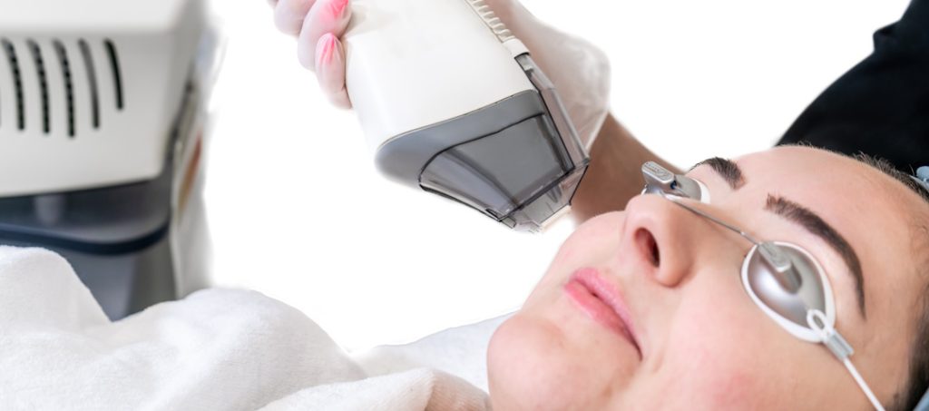 woman receiving fraxel laser treatment