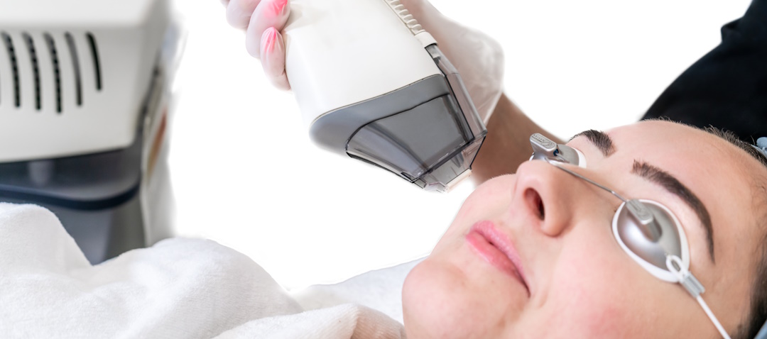 woman receiving fraxel laser treatment
